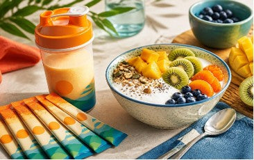 Daily Power Sticks with a smoothie and a fruit bowl